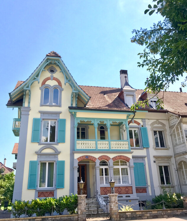 design+home+switzerland+european+quaint+robins+egg+blue+shutters+brick+arches+roof+ochre+beige+blogger