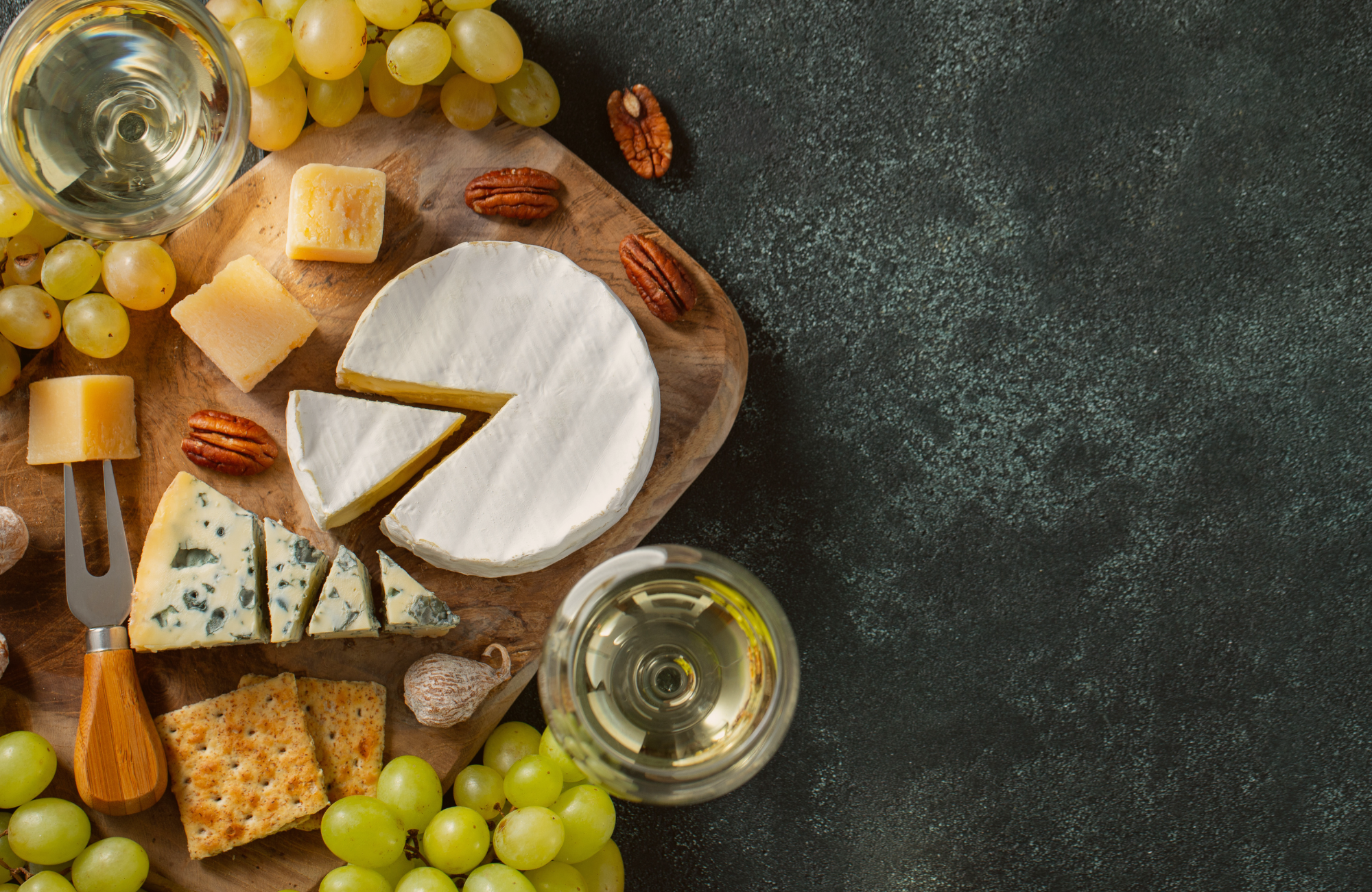 charcuterie board wine cheeses grapes